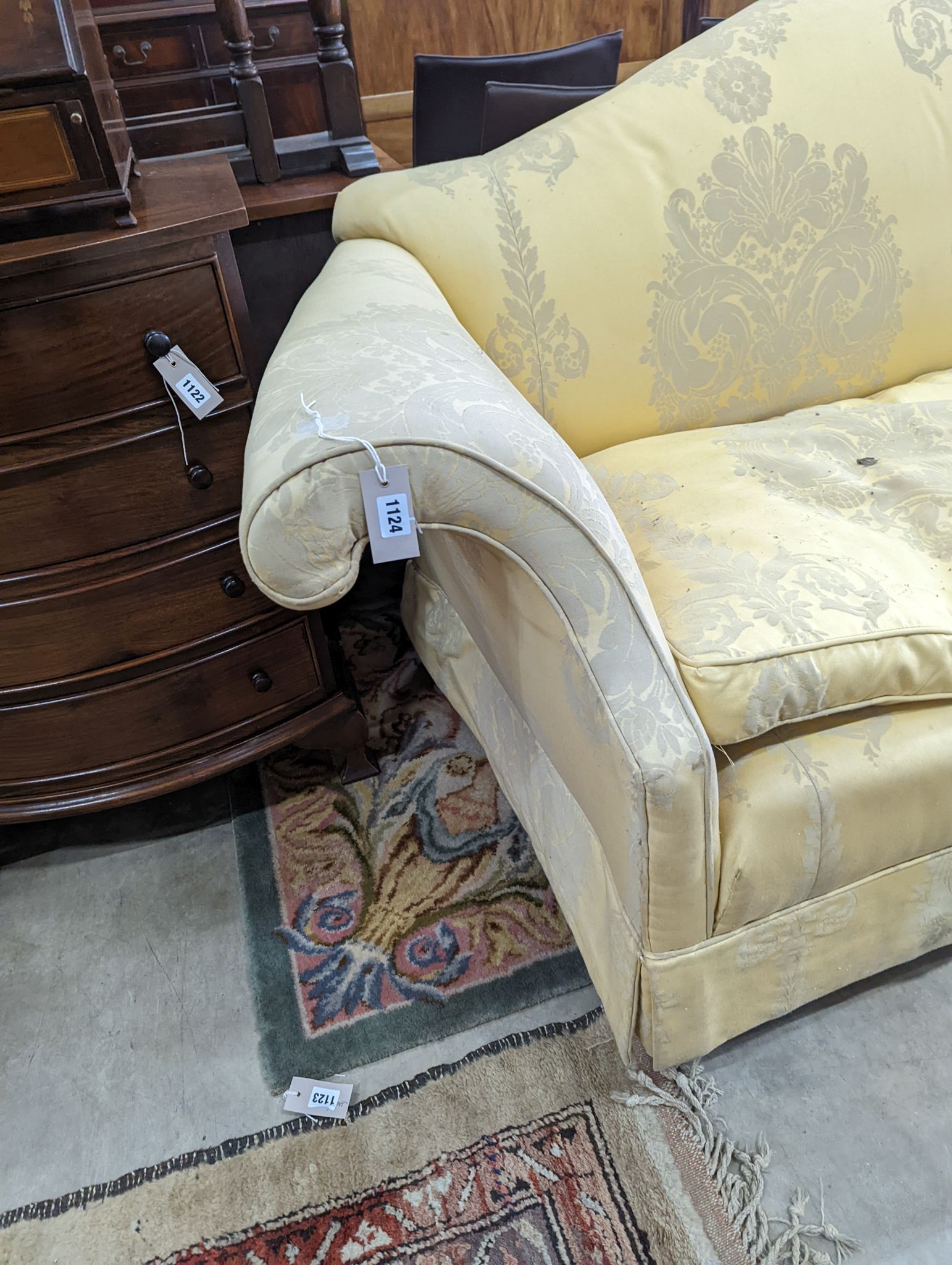 A George III style two seater upholstered scroll arm settee, length 200cm, depth 86cm, height 80cm